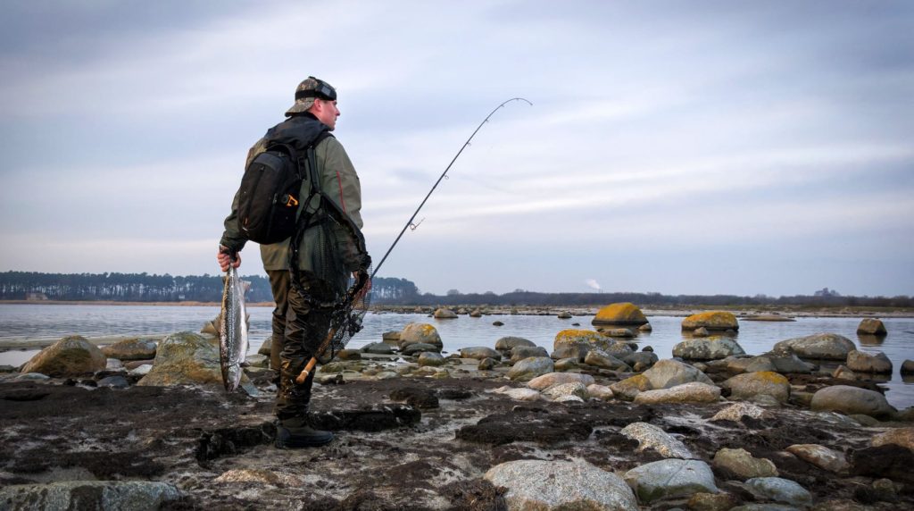 https://intoflyfishing.com/wp-content/uploads/2020/04/Best-8-Weight-Fly-Rods-Guy-walking-on-beach-saltwater-fly-fishing-1024x572.jpg