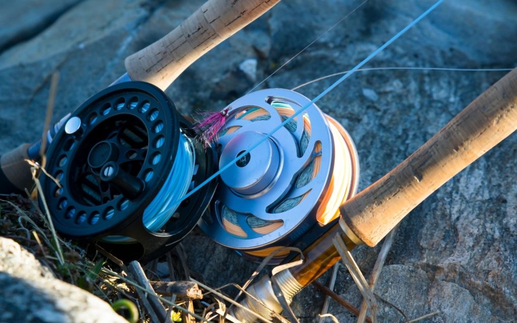 A fly reels and a water on the backgroud