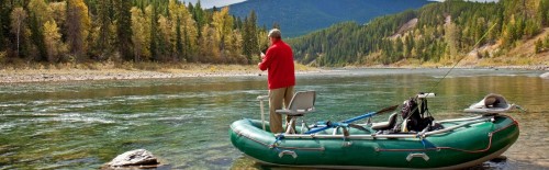 An angler fly fishing Flathead River in Montana.