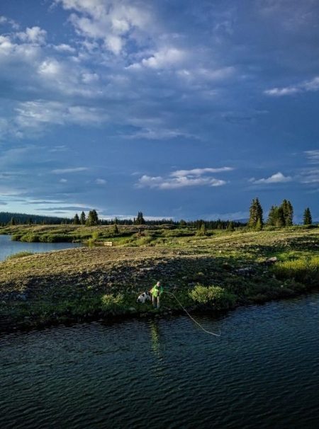 a fly angler fishing in the lake