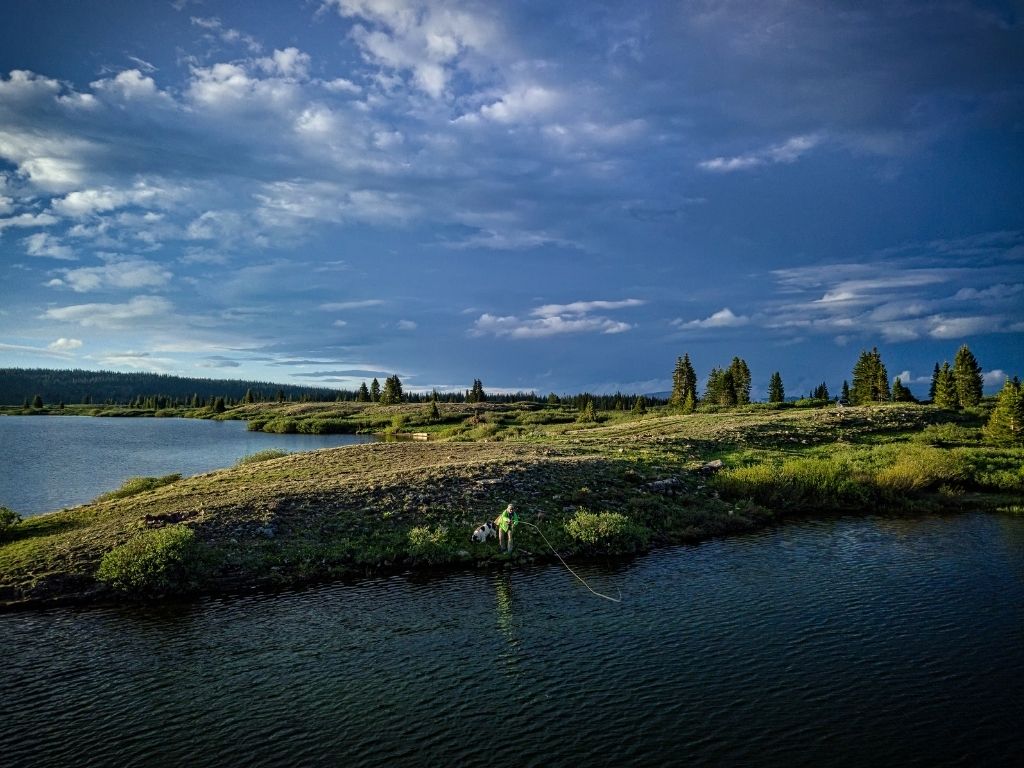 a fly angler fishing in the lake