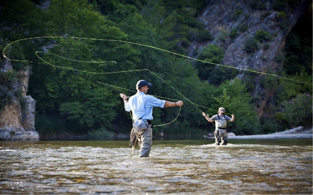 anglers fishing in the river
