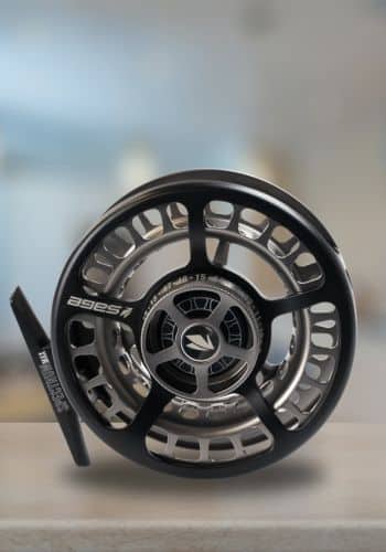Sage Spectrum Max Fly Reel Sitting on a Table inside
