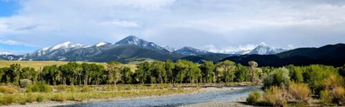Montana river with gravel bars and snow-capped mountains near Livingston