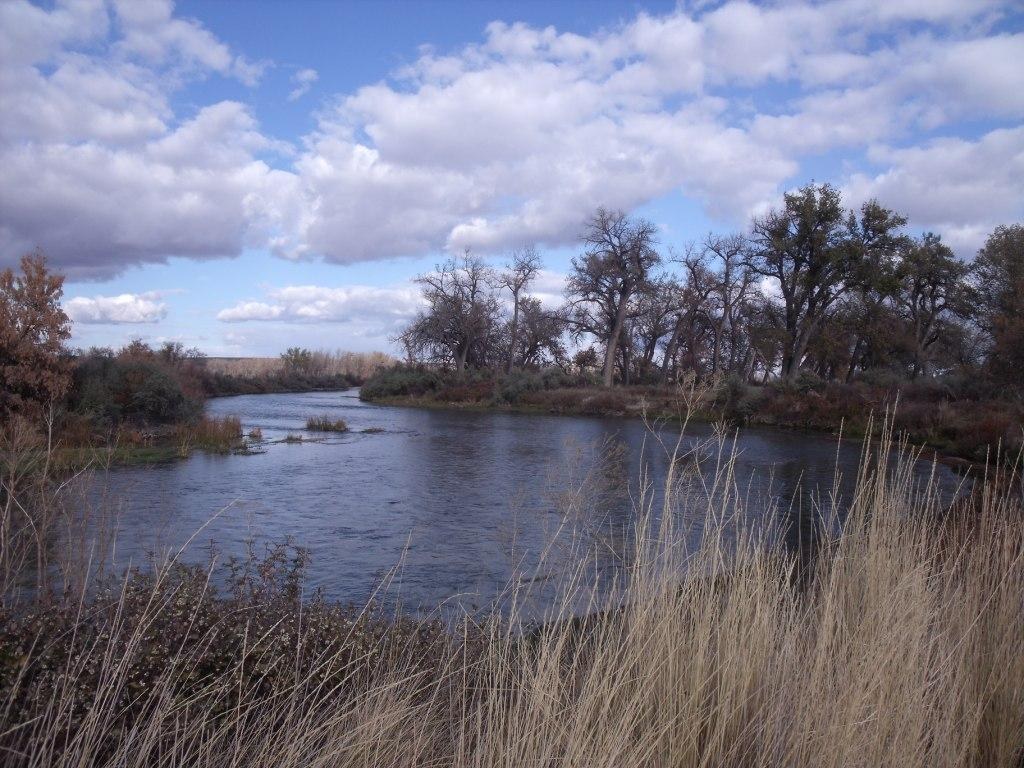 The Bighorn River in Montana beneath a cloudy sky