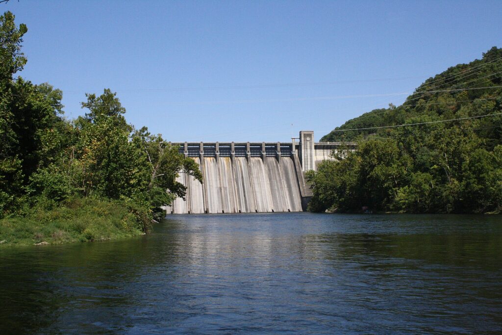 Norfork Dam with the Norfork River tailwater in the foreground.