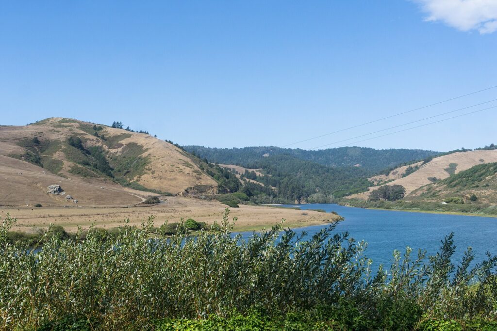 Russian River in California with dry hills above the water