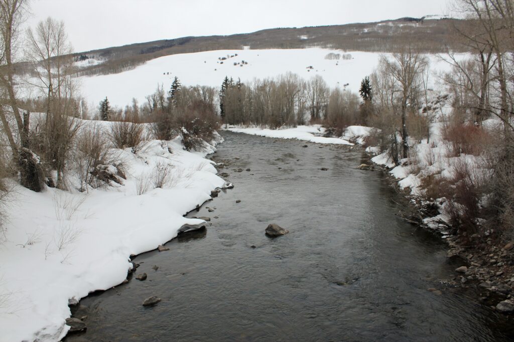 The East River in winter, viewed from the Highway 135 bridge in Colorado.