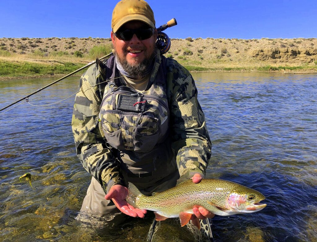 Angler holding a rainbow trout