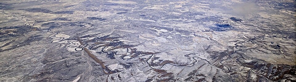 A snowy aerial view of the Yampa River between the Craig and Maybell area